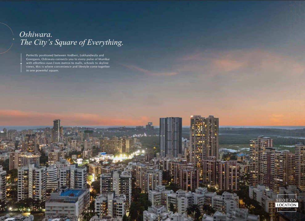 Luxury high-rise tower with rooftop amenities overlooking a bustling roadside in Andheri West